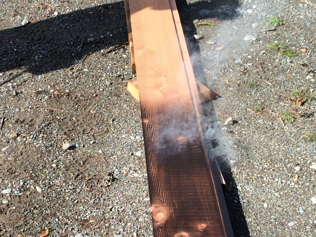 burning cedar siding